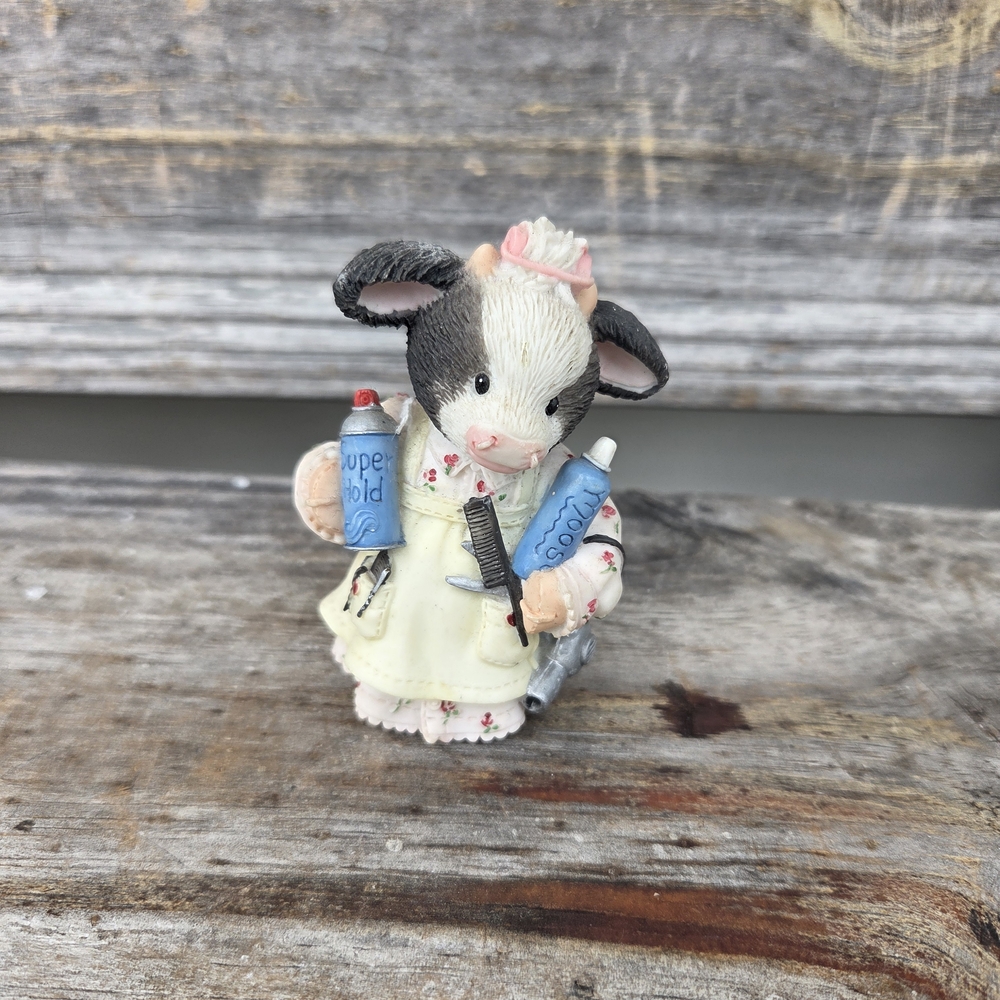 Charming Cow Figurine with Blue and Cream Accents